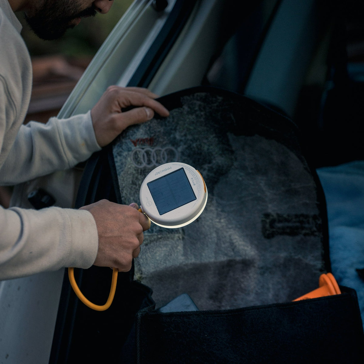 Luci Core Utility Solar Light shining in a bag