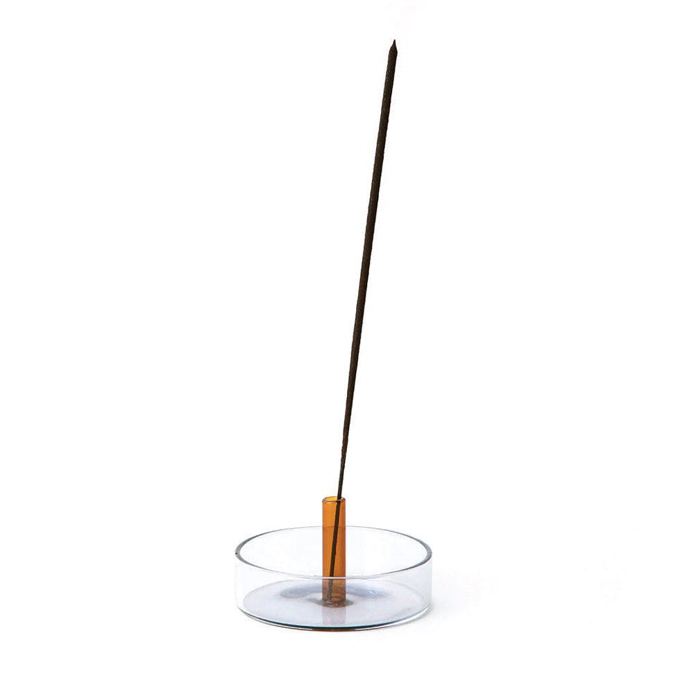 Incense holder on display with incense stick.