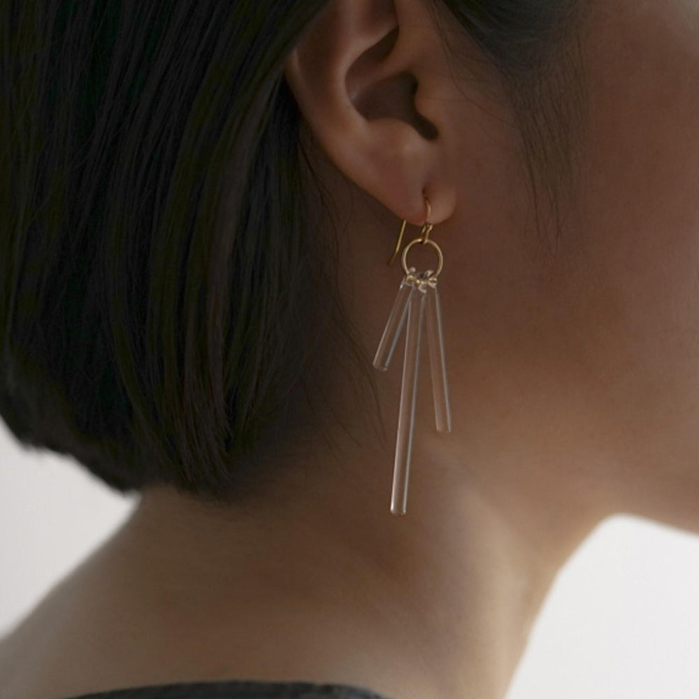 Model wearing earrings.