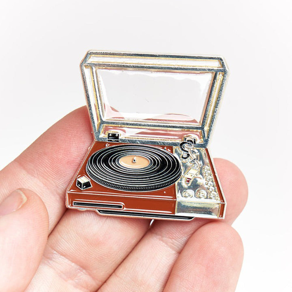 Hand holding Vintage Record Turntable Pin.