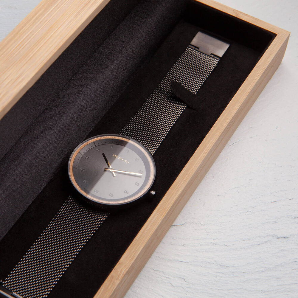 Watch in a wooden box.