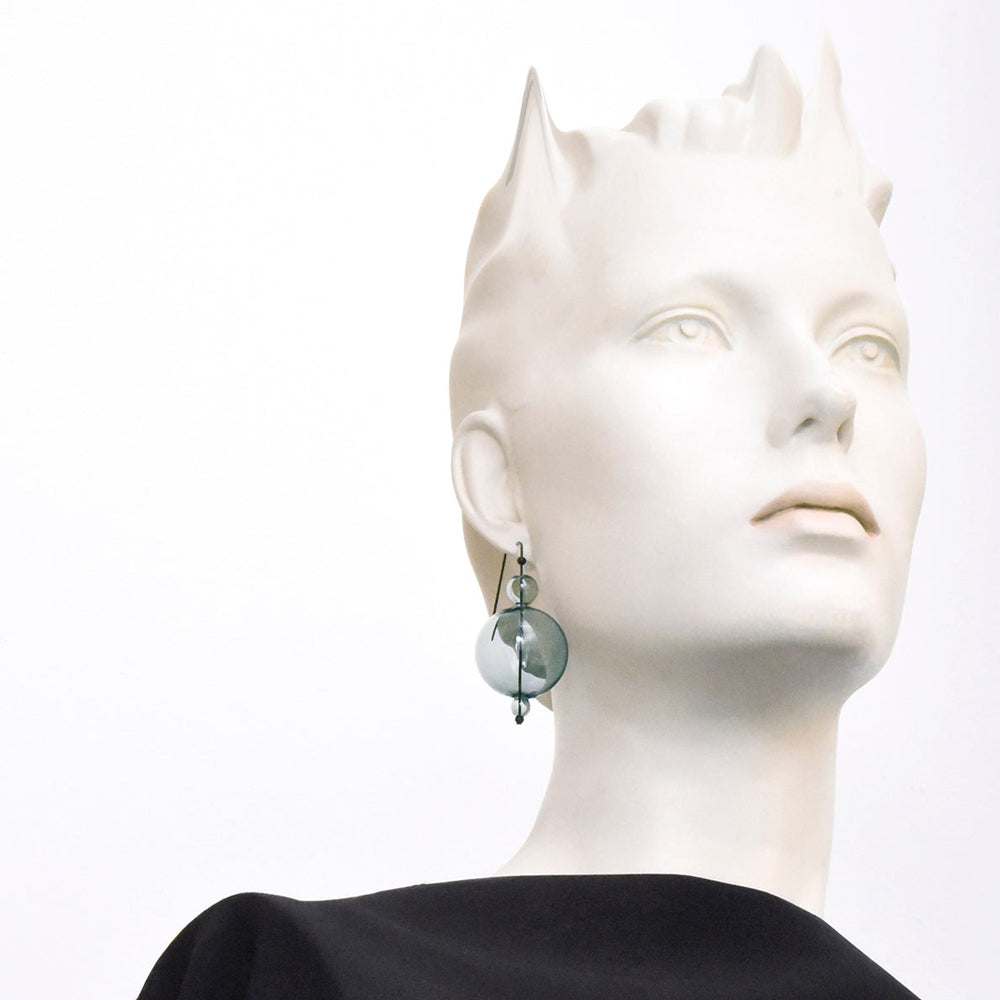 Mannequin wearing earrings.