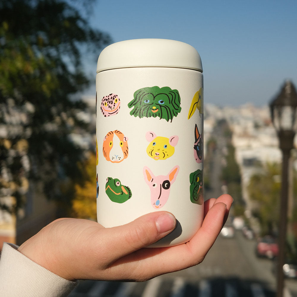 Fellow Everywhere Mug, designed by Kristina Micotti, with SF landscape in background.