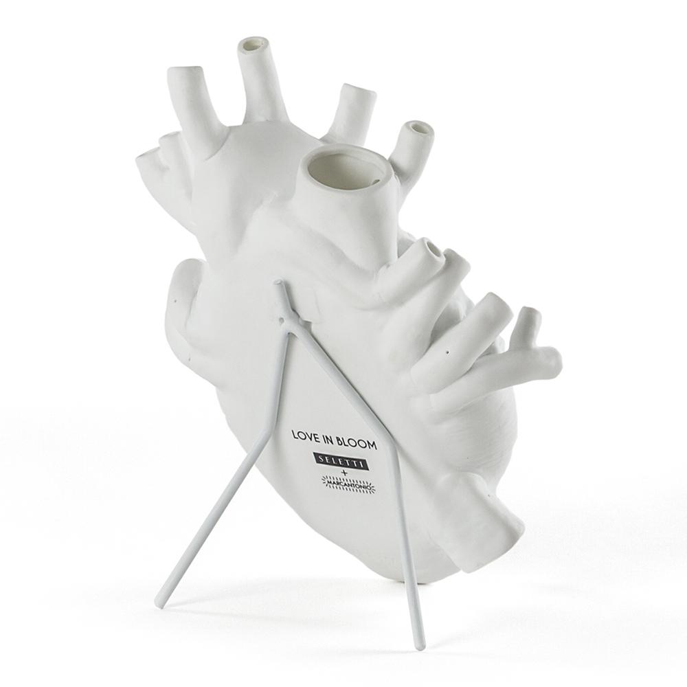 Back view of the Porcelain Heart Vase: White mounted on its stand.