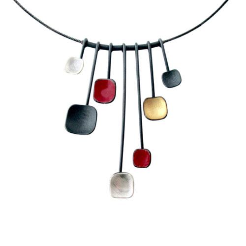 Close up of the Owen McInerney: Red Square Necklace&#39;s pendants.
