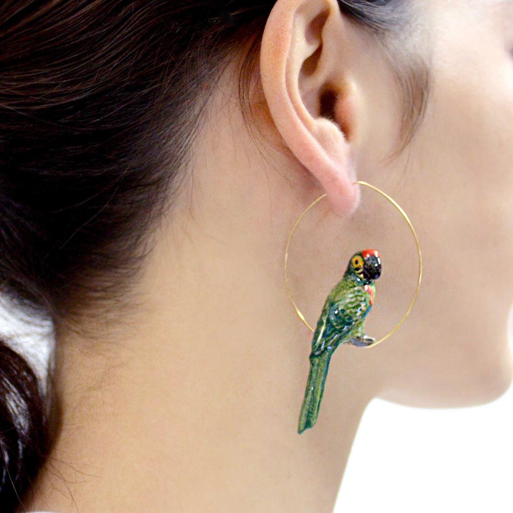 A model wearing a Nach: Parrot Earring.