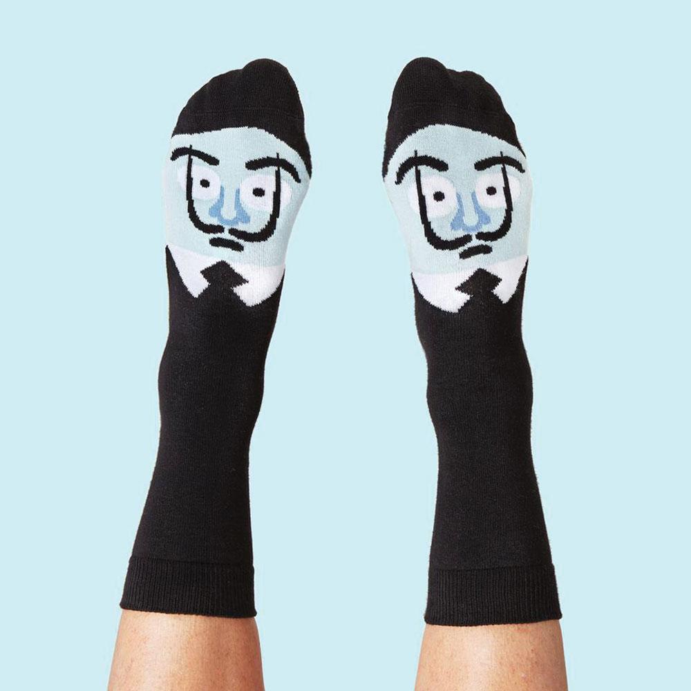 Feet wearing Sole-Adore Dalí Socks: Large.