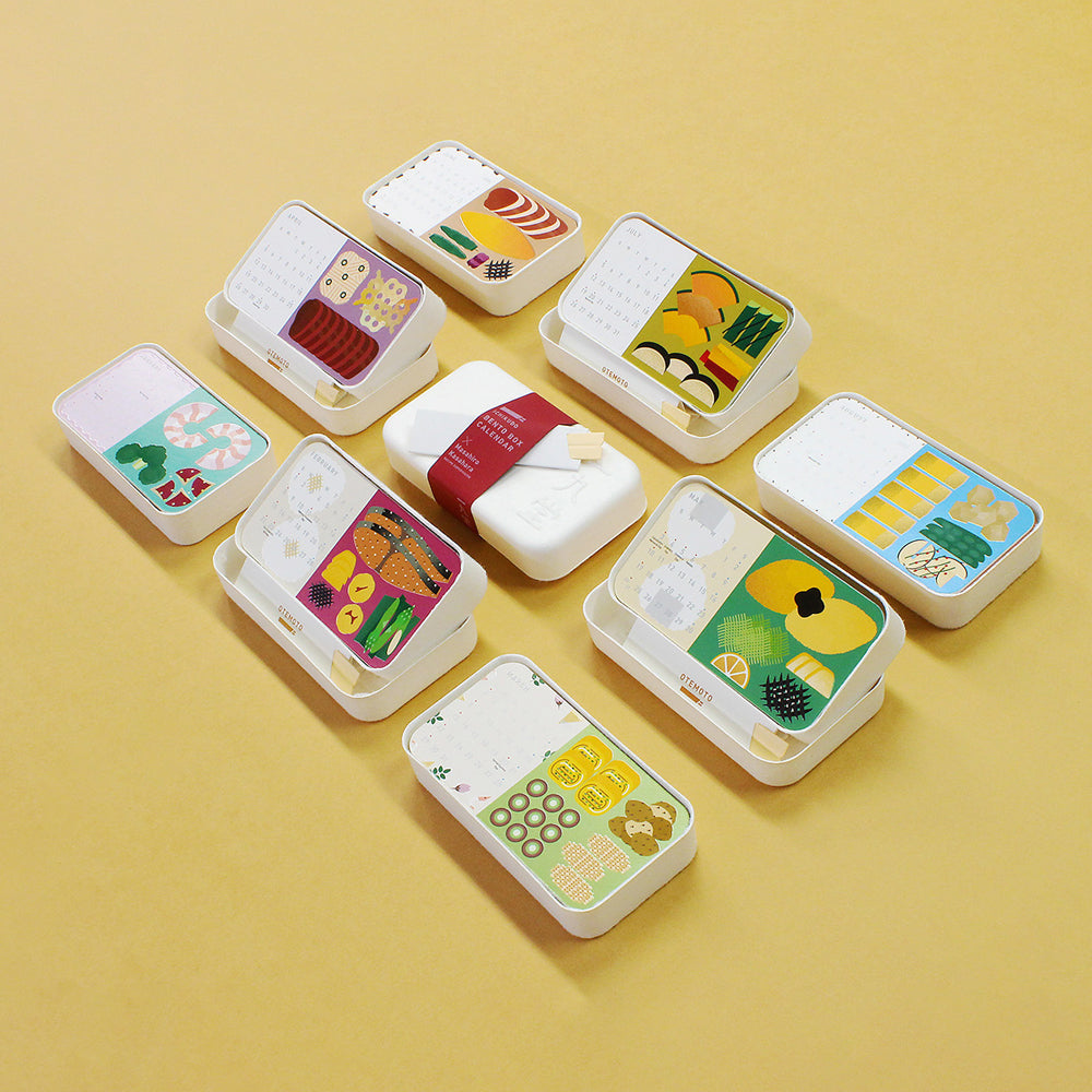 Set of small, rectangular bento boxes with food illustrations on a beige background