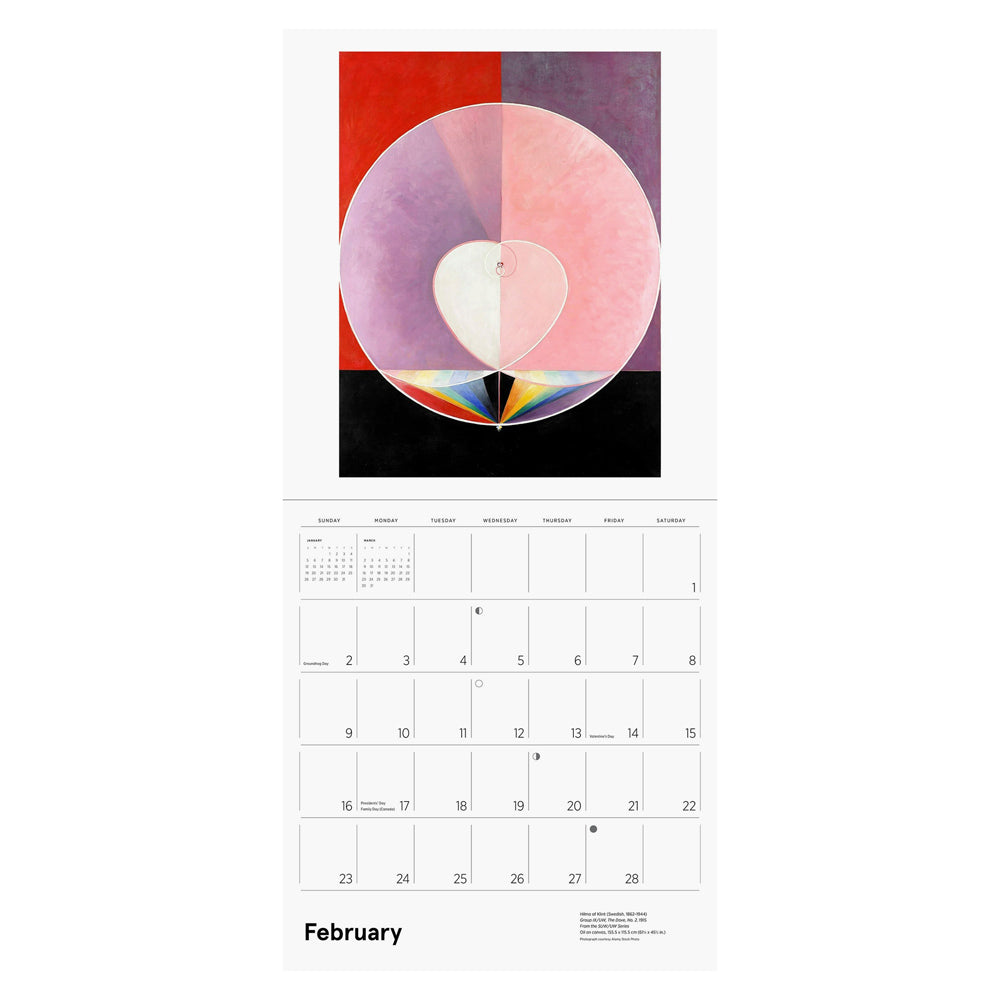 Interior of wall calendar with artwork and February month grid.