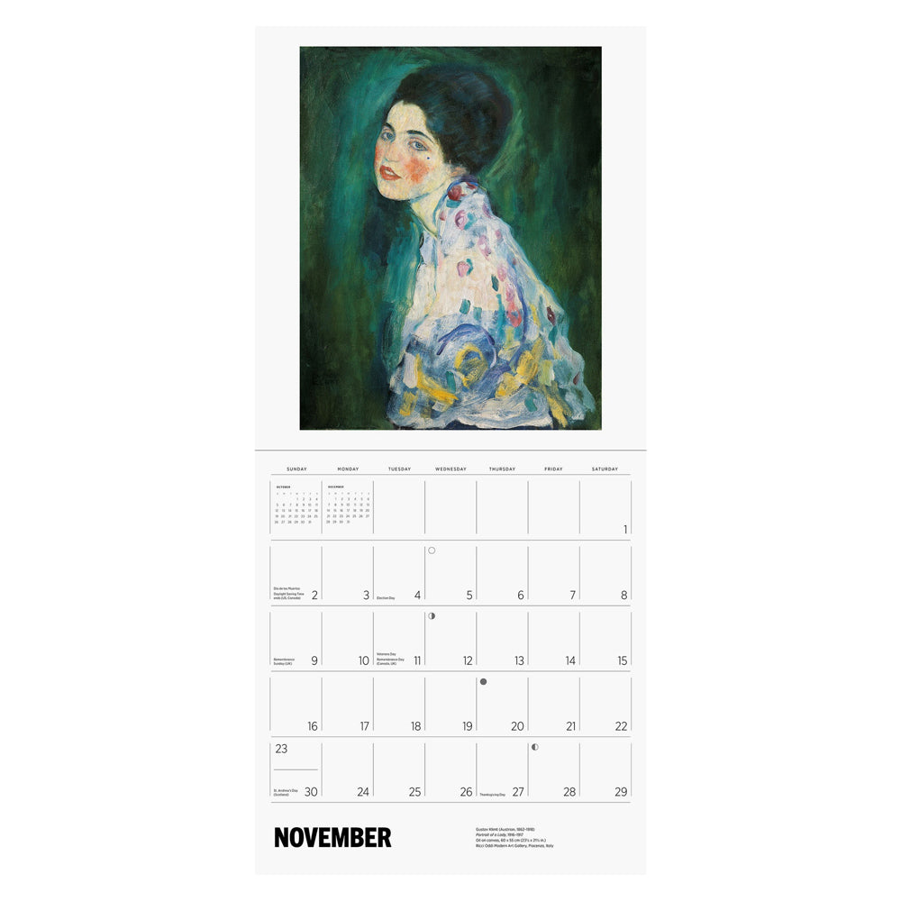 Interior of wall calendar with artwork and November month grid.