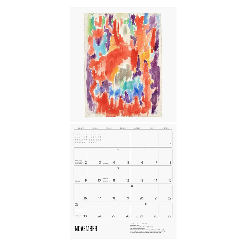 Interior of wall calendar with artwork and November month grid.