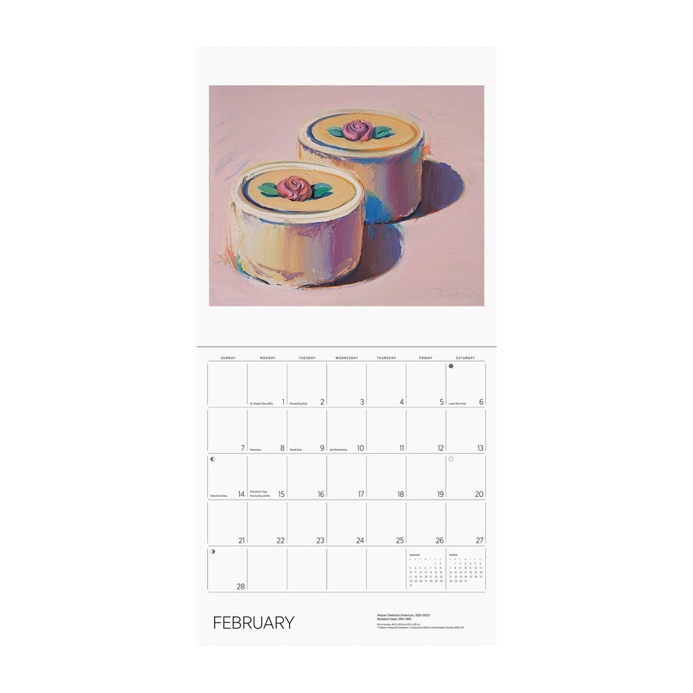 Calendar page for February with two round cakes. 