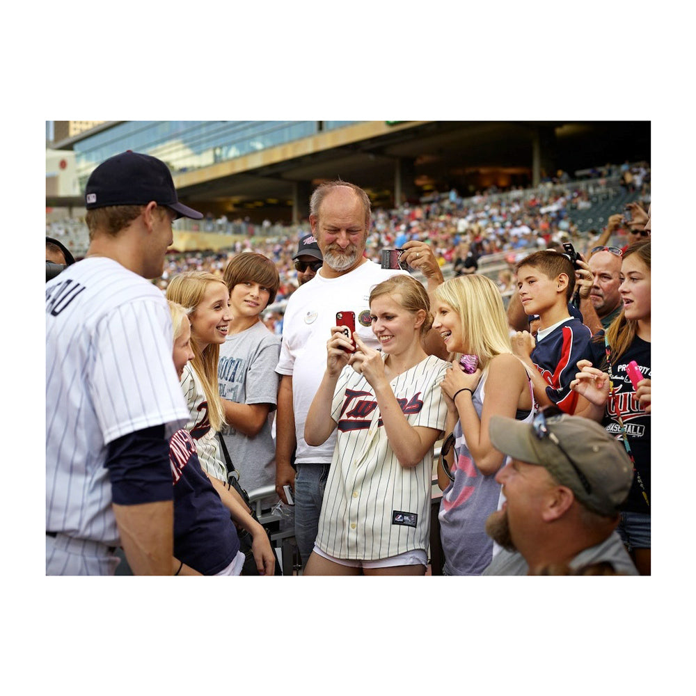 Interior page; image of baseball player and fans.