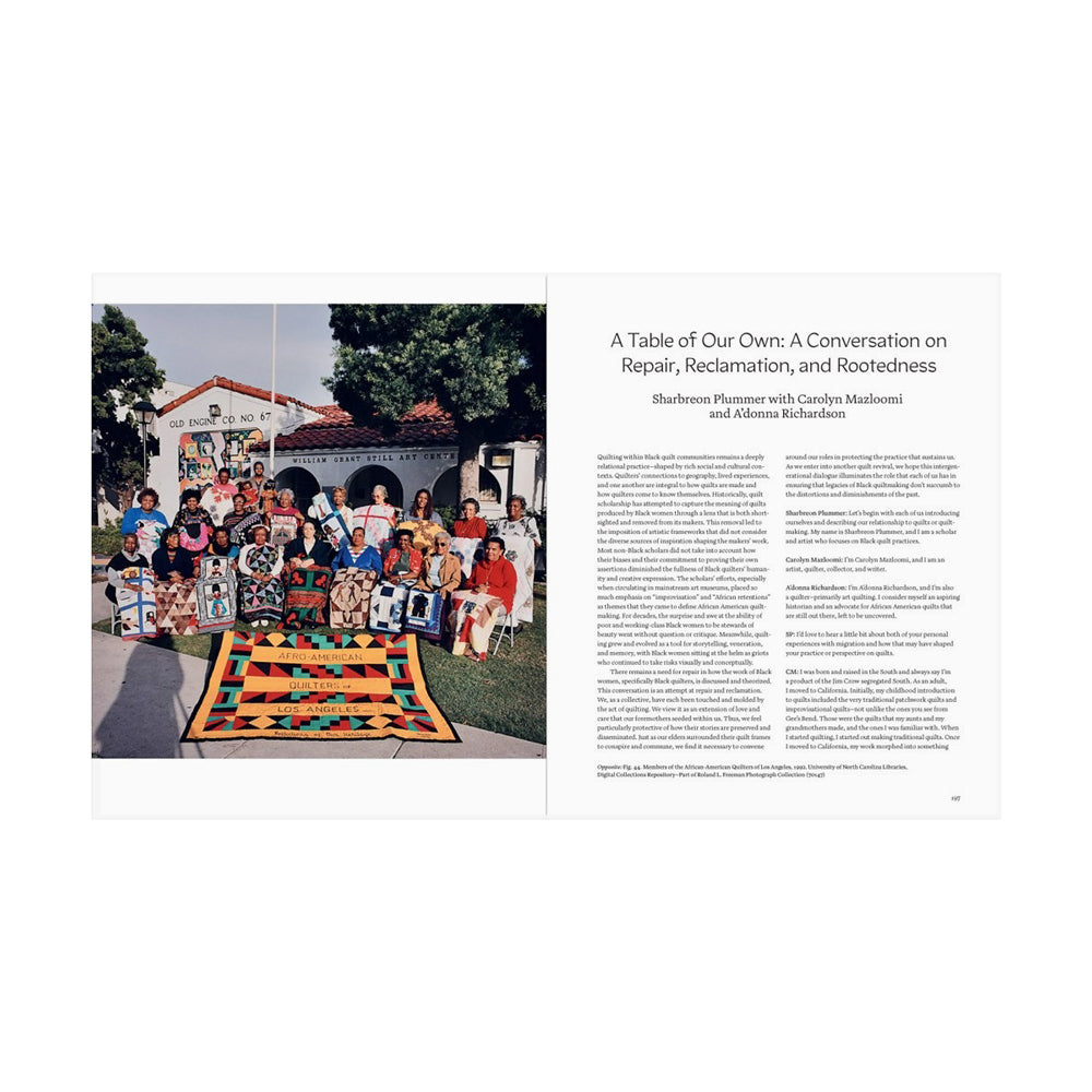 Interior pages featuring a photograph of a group of people with quilts in front of a building and text.