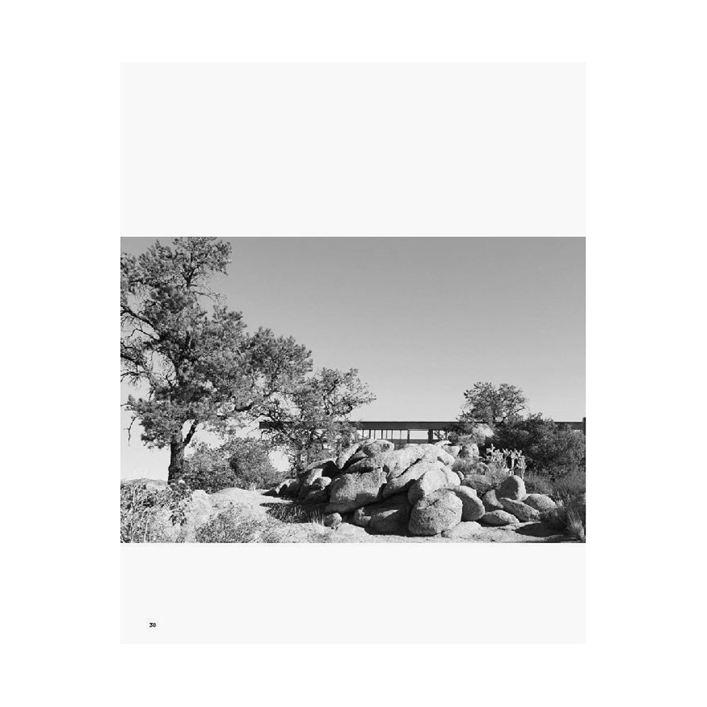 Black and white image of home in desert.