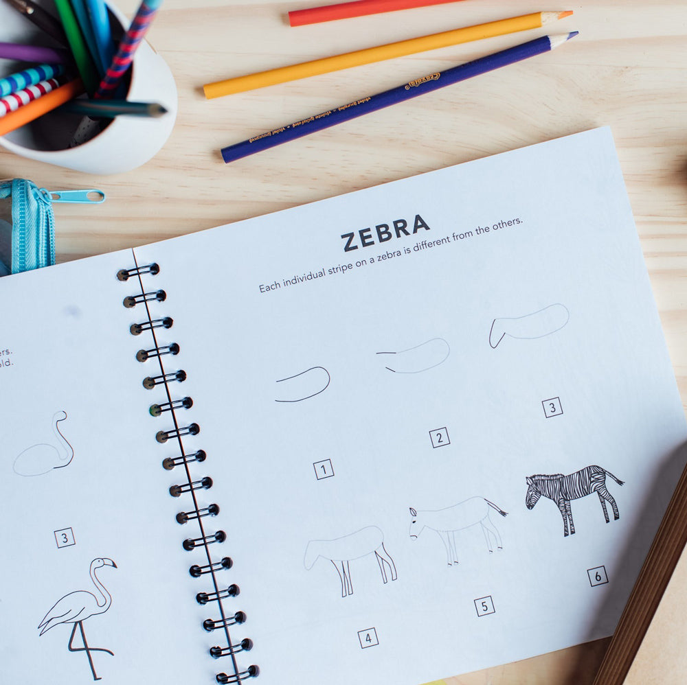 Interior page featuring step-by-step instructions how to draw a zebra.