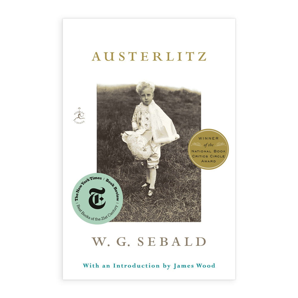Book cover of 'Austerlitz' by W.G. Sebald with a black and white photo of a child and award badges.