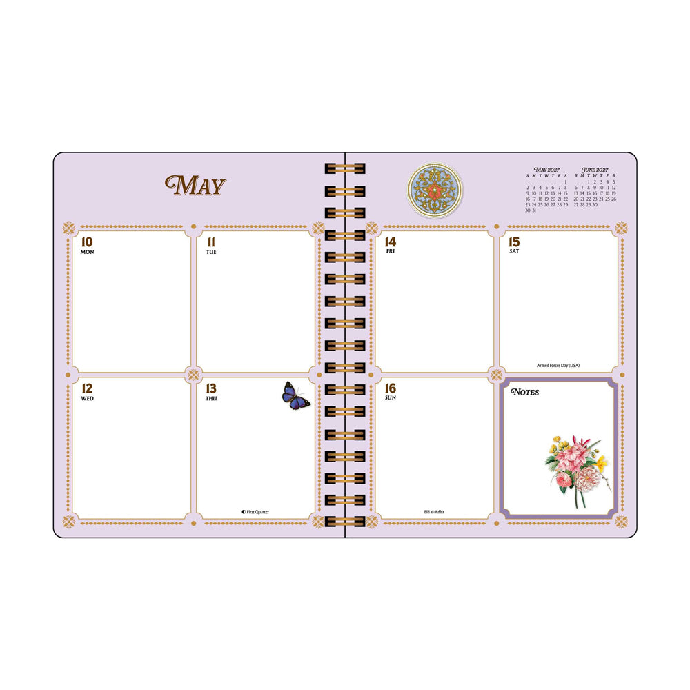 Interior spread featuring grid spaces for  a week in May. 