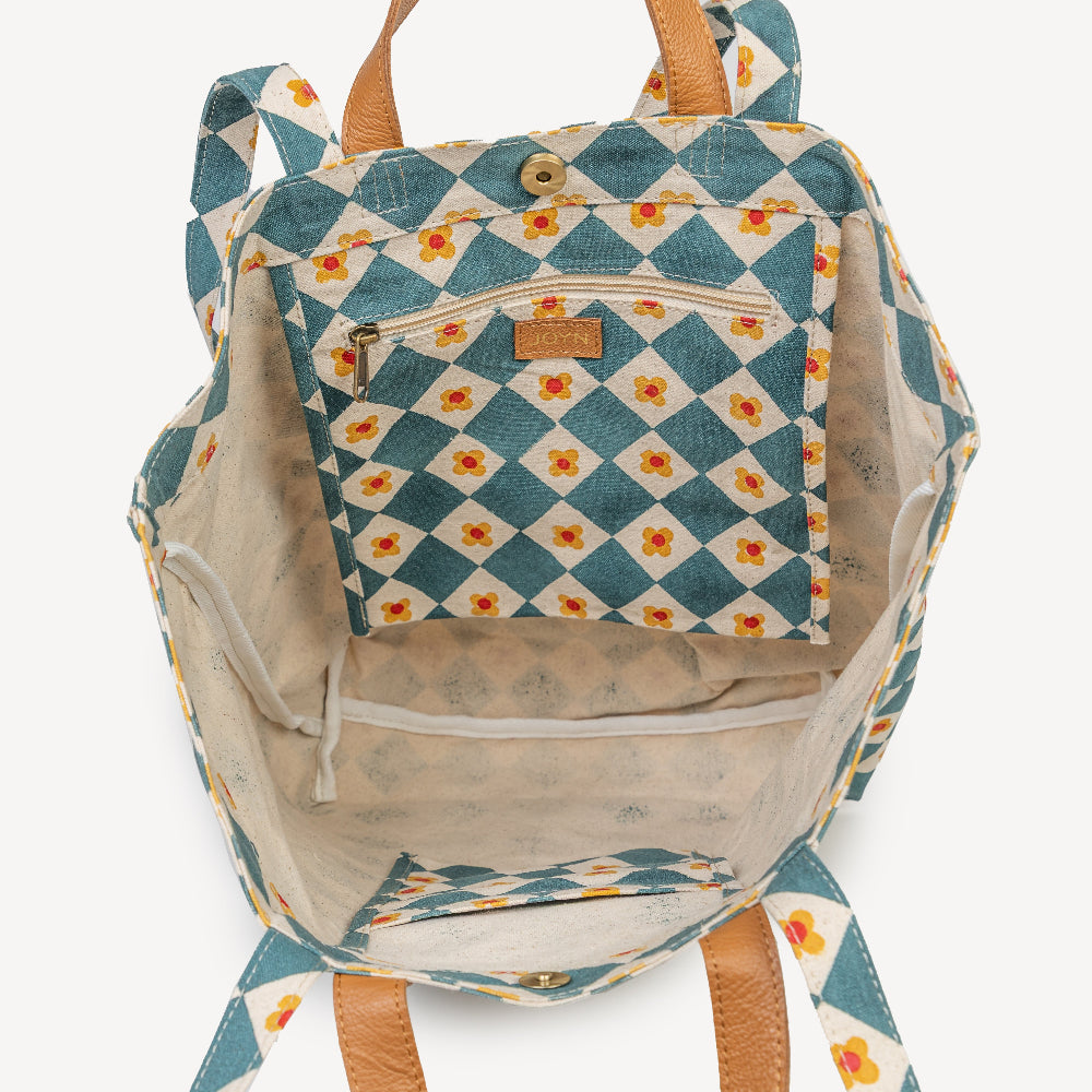 Backpack with blue and white checkered pattern and floral design on a white background