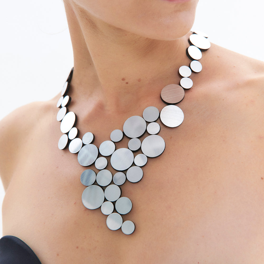 The Iskin Sisters: Silver Abstraction Necklace displayed.