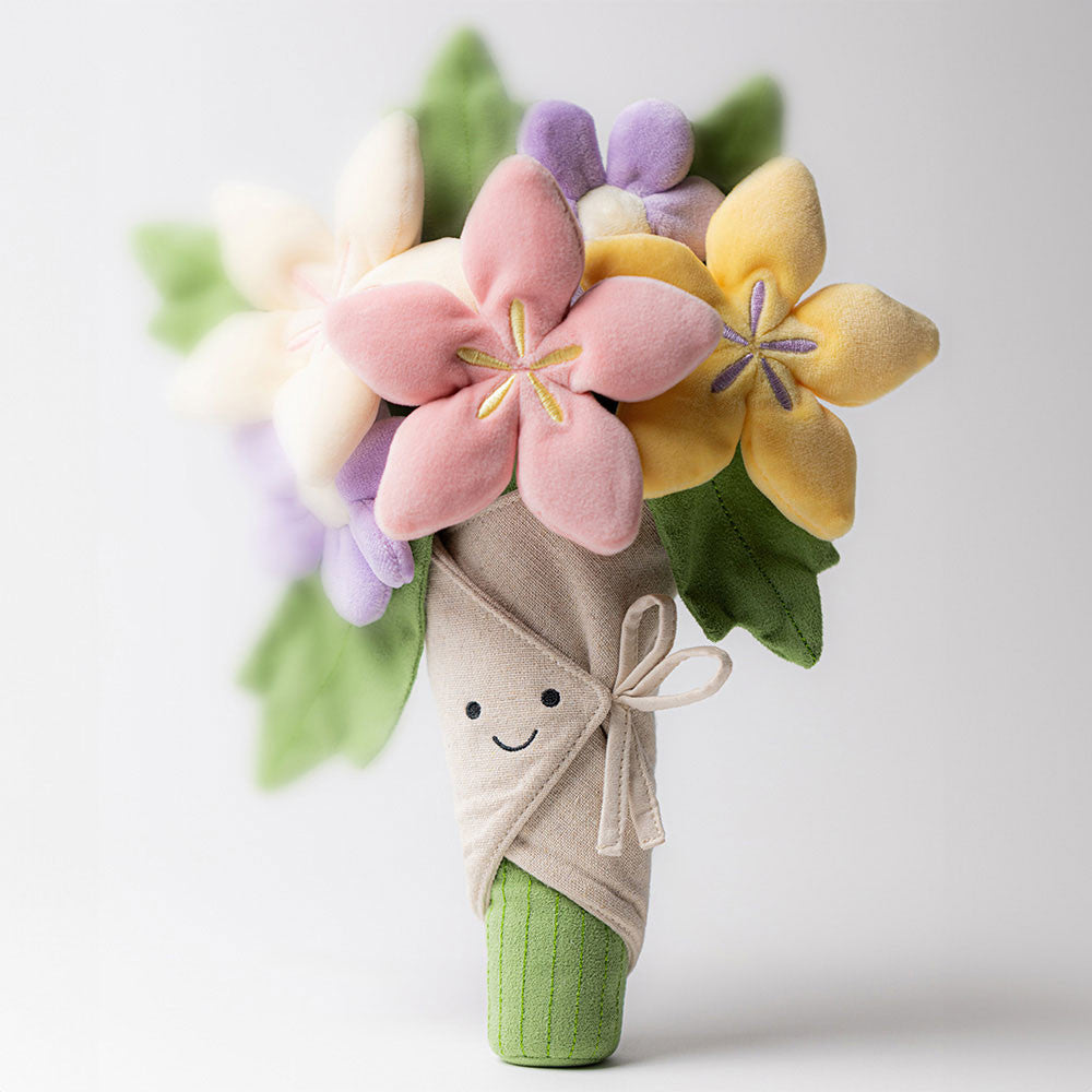 Toy flower bouquet with a smiling face on a white background