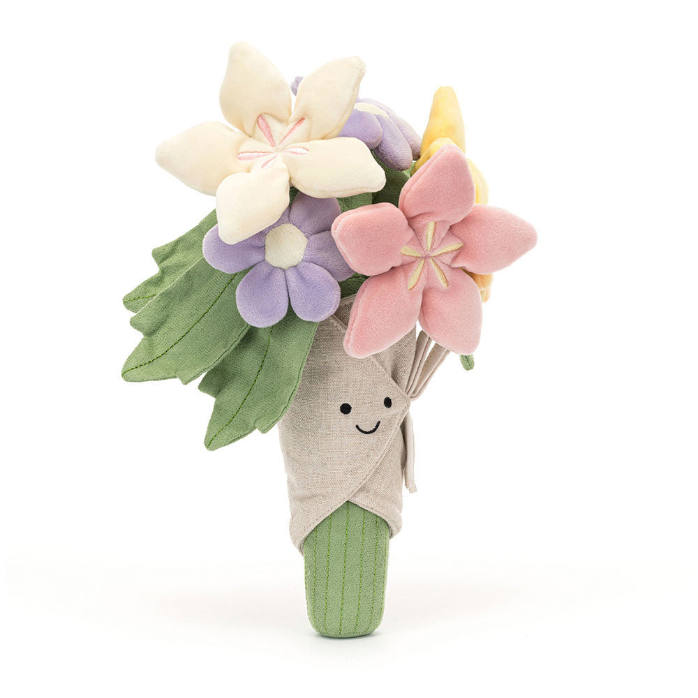 A plush toy bouquet featuring a smiling beige wrapped stem, green leaves, and three fabric flowers in cream, pink, and lavender, set against a plain white background.