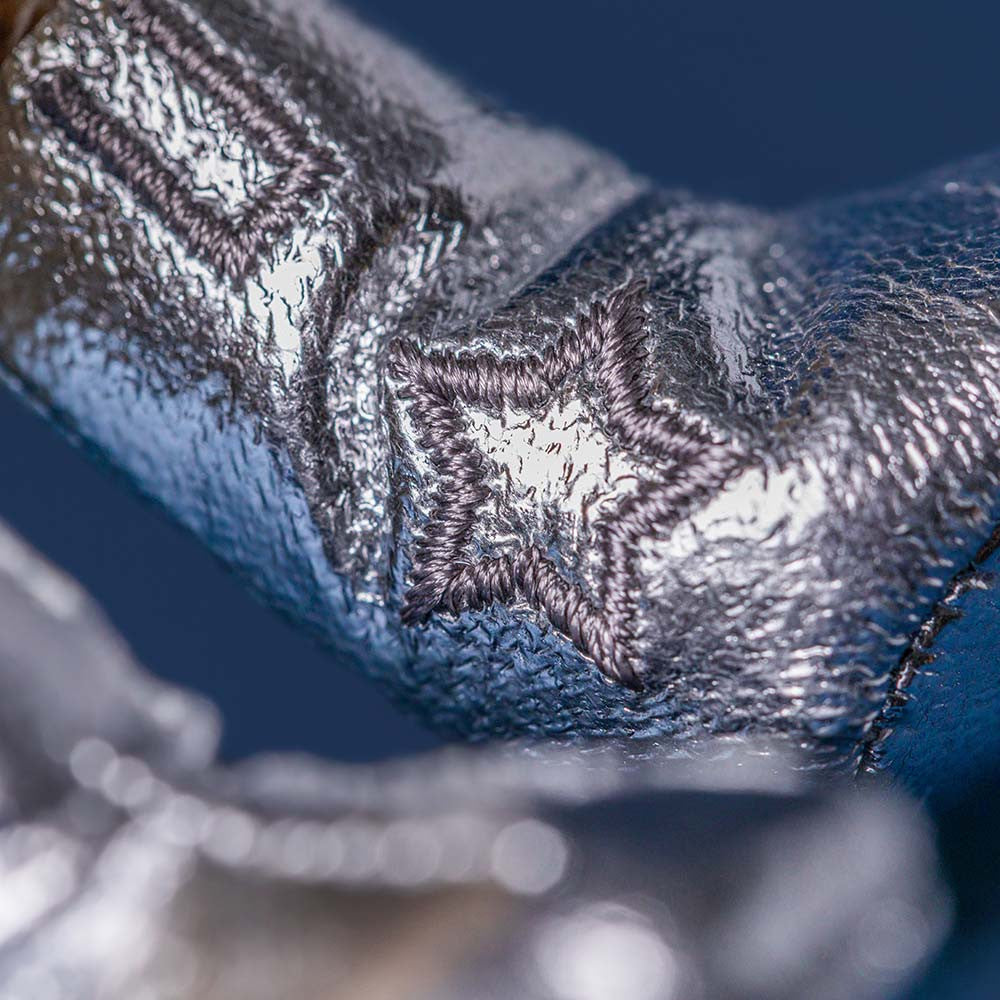 Close-up of a textured metallic surface with a star design.