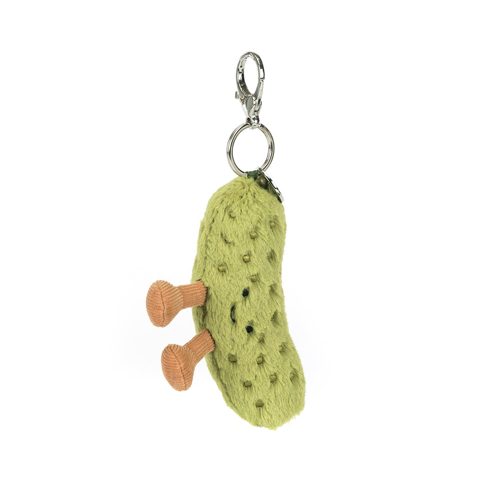 Green pickle plush keychain with a small brown legs on a white background