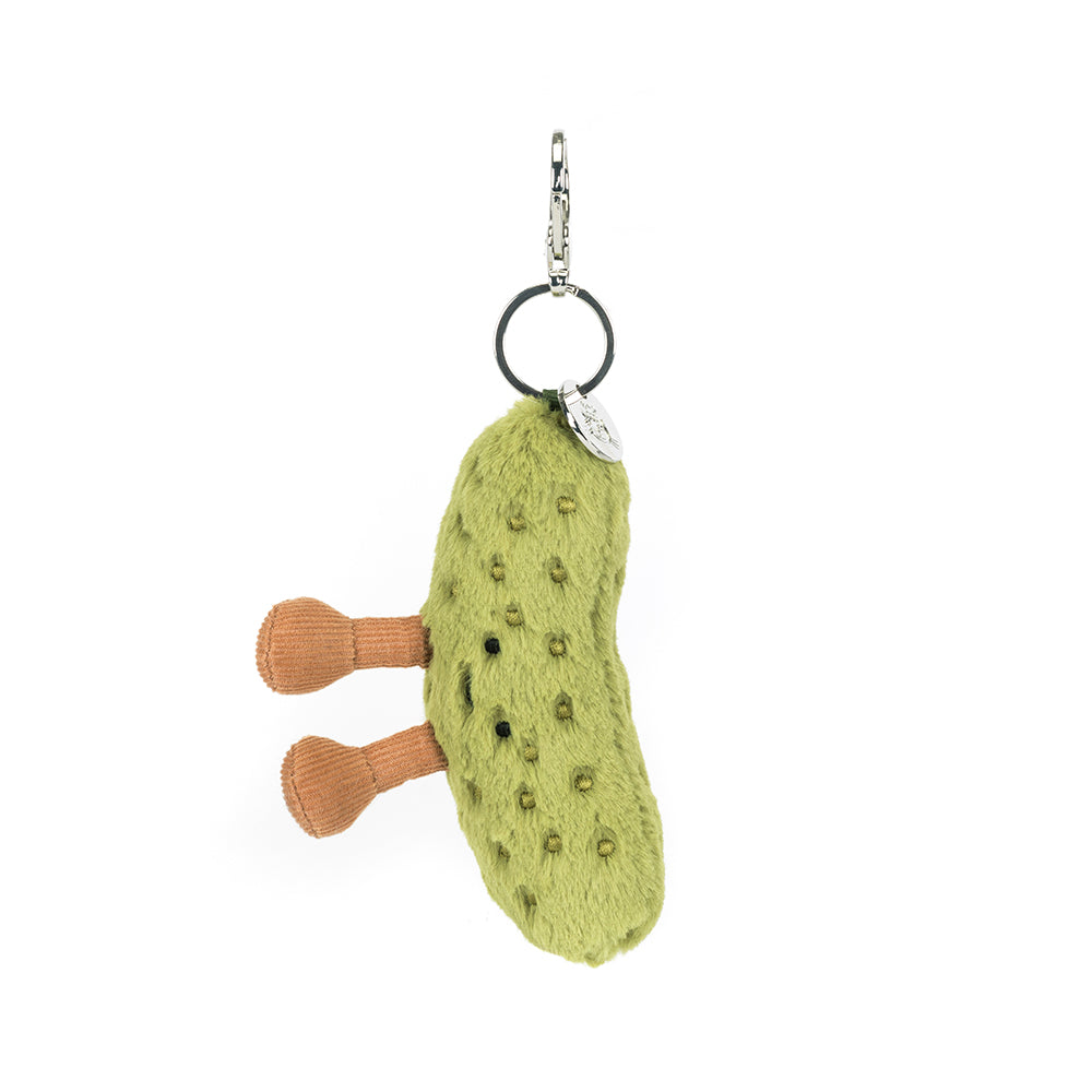 Green pickle plush keychain with a small brown legs on a white background