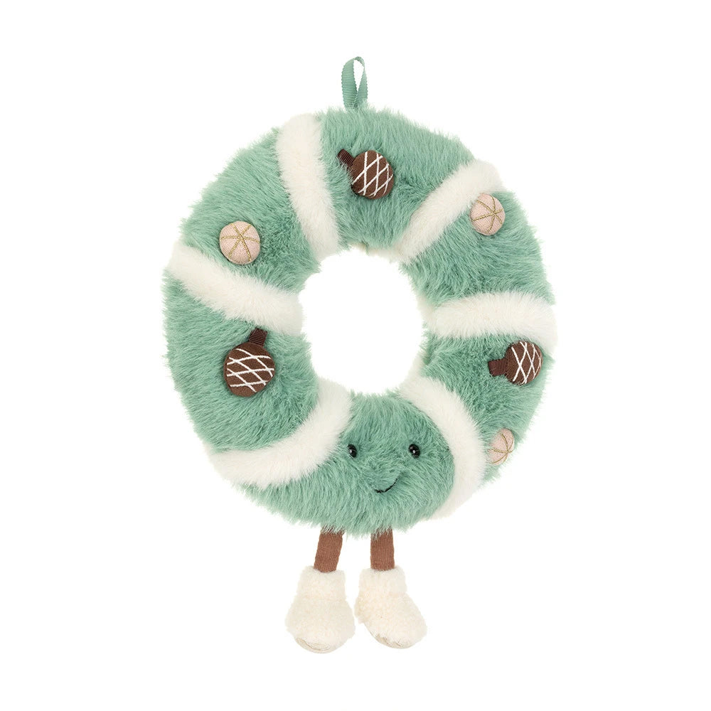A plush green and white striped wreath-shaped ornament with acorn and pinecone details, a hanging loop, and small legs with white feet, shown on a plain white background.
