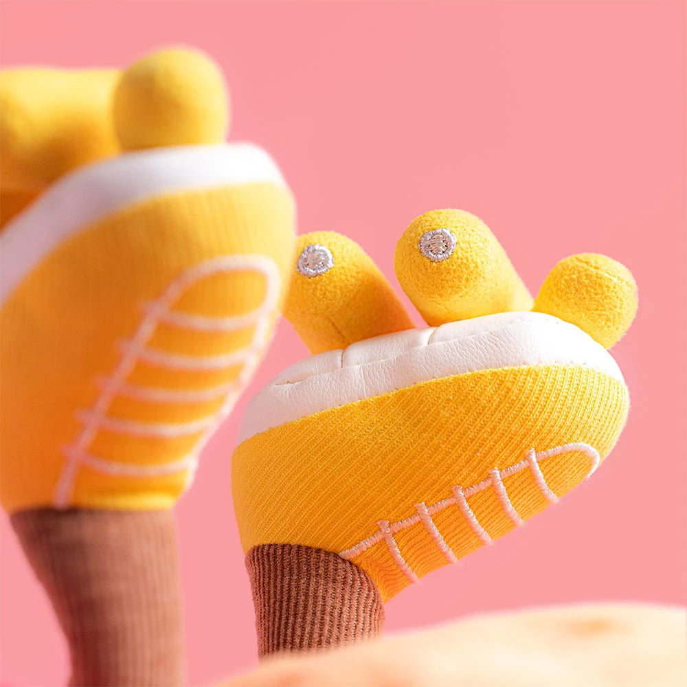 Yellow rollerskates with white soles on a pink background