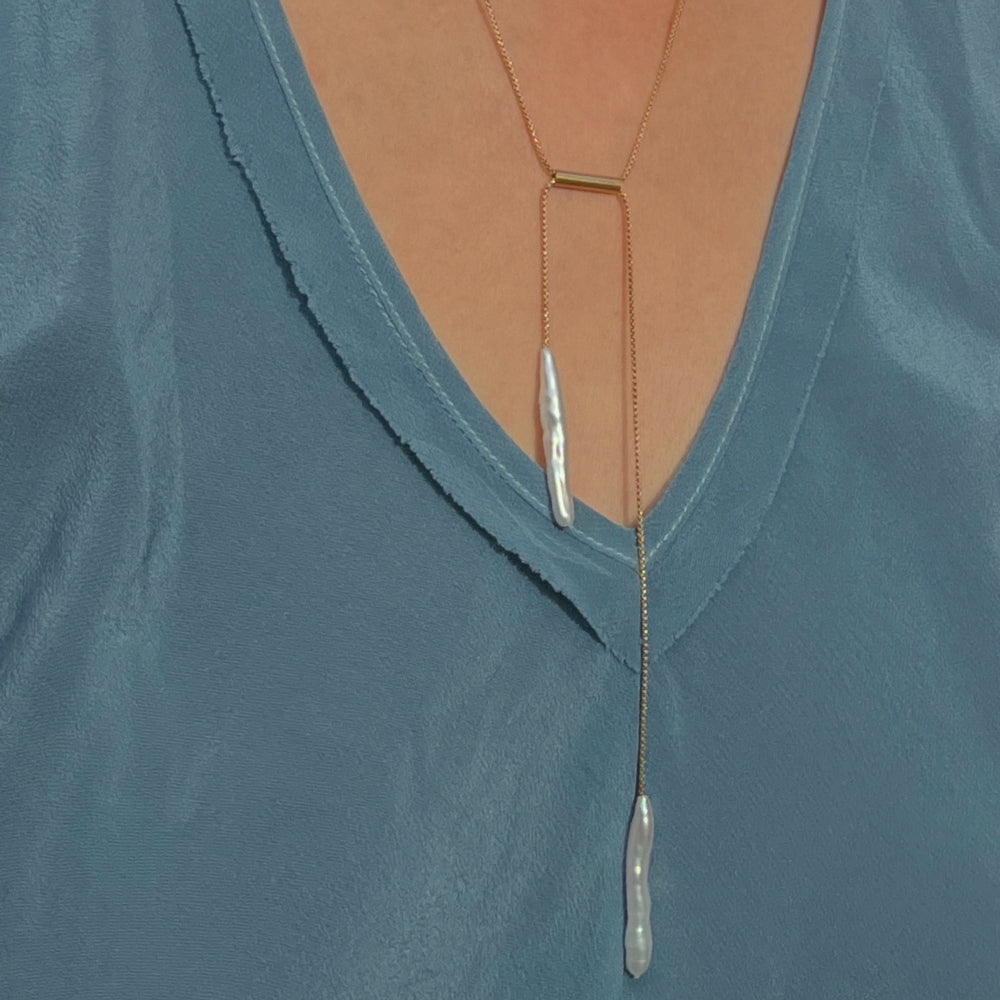 Model wearing necklace.