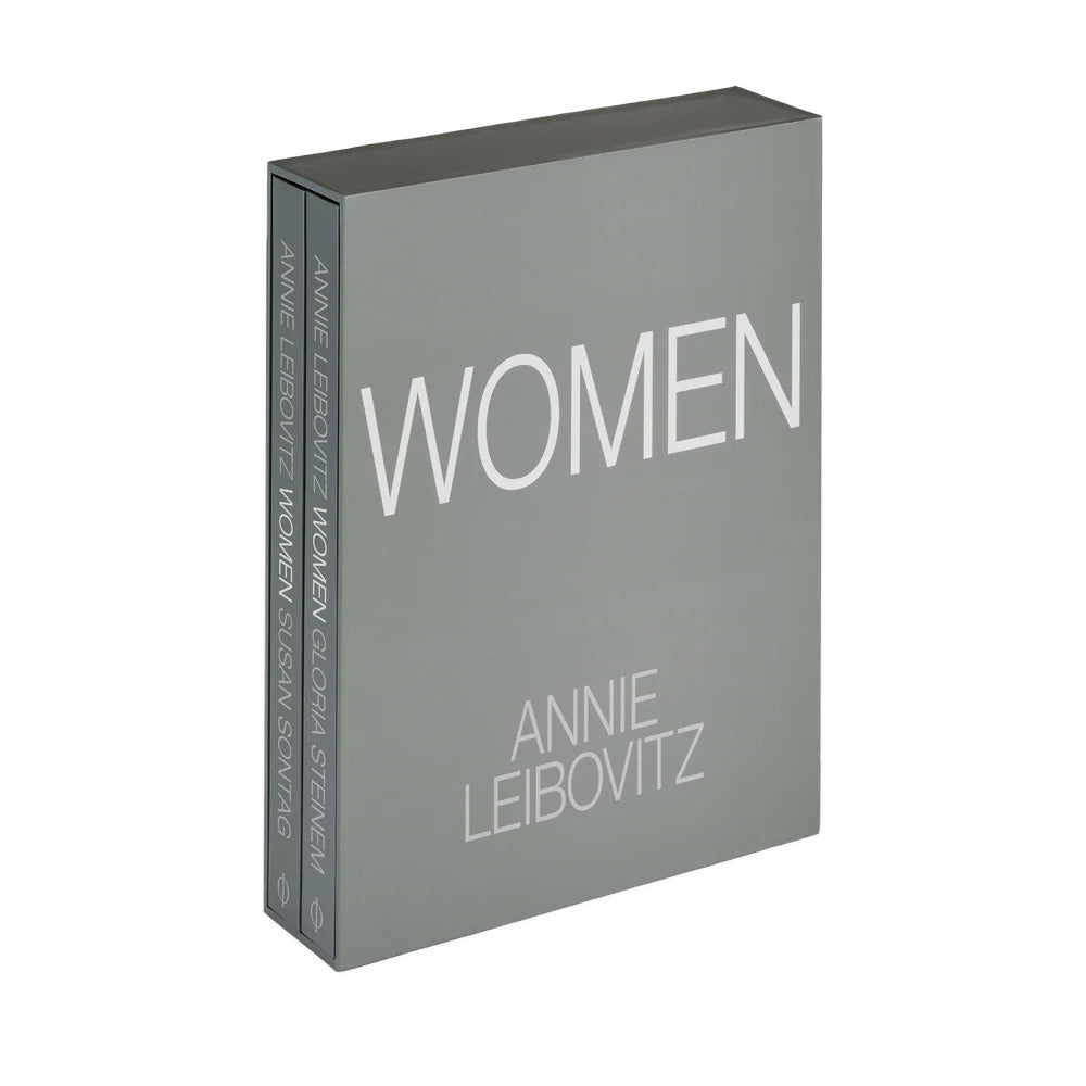 Book titled 'WOMEN' by Annie Leibovitz on a white background