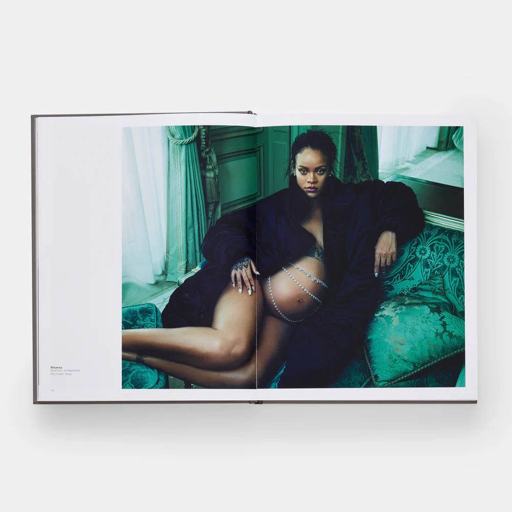 Framed artwork of a person sitting on a couch with a green background