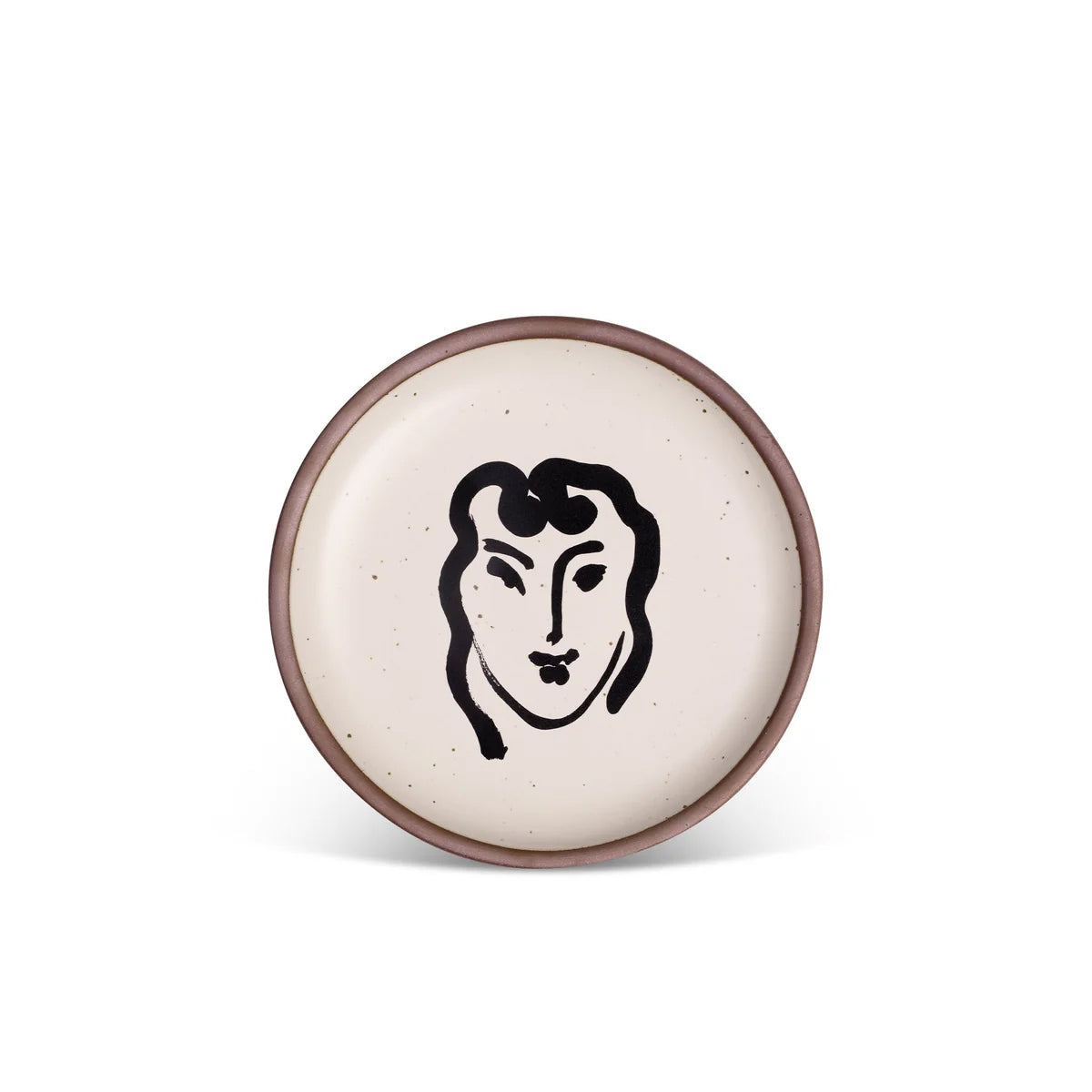 Round ceramic plate with a face design on a white background