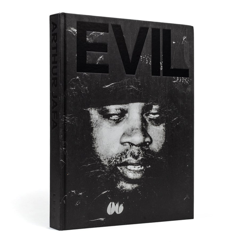 Book titled 'EVIL' with a black and white portrait on the cover