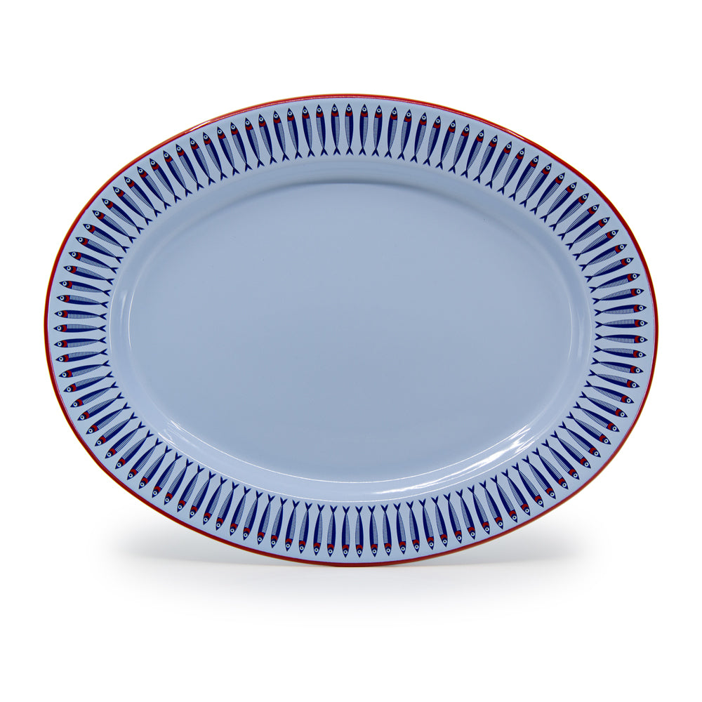 Blue oval plate with decorative border on a white background