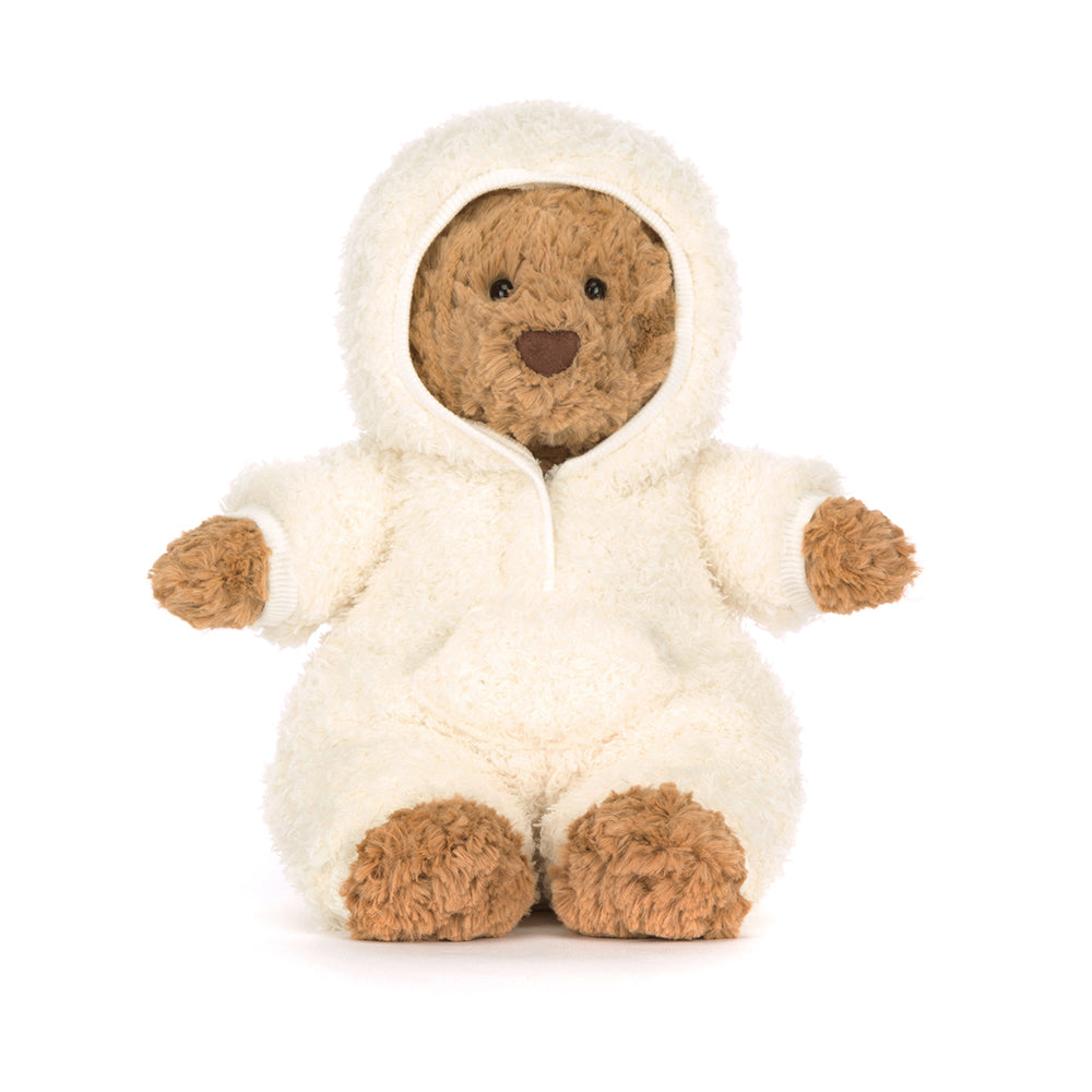 Stuffed bear in a white onesie with brown paws and face on a white background
