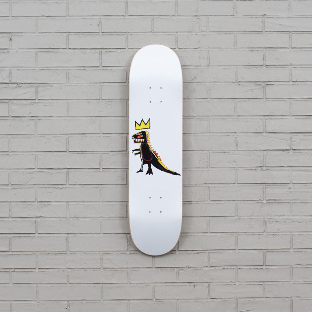 Skateboard on brick wall.