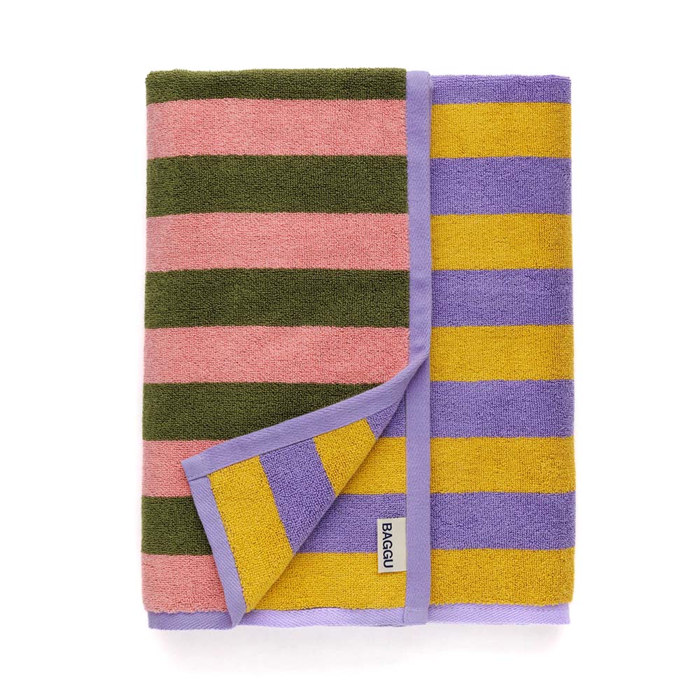 BAGGU Bath Towel in Sunset Stripe colorway, folded neatly with tag displayed.