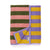 BAGGU Bath Towel in Sunset Stripe colorway, folded neatly with tag displayed.