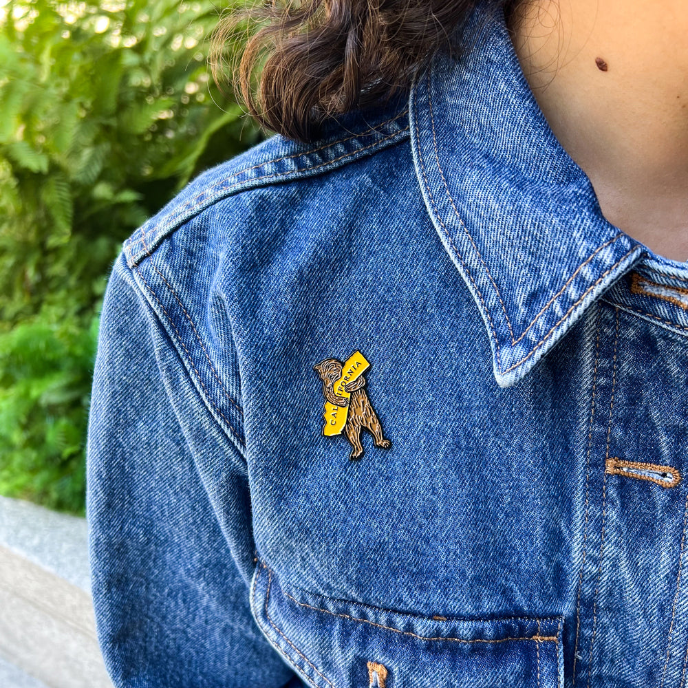 Bear pin on jean jacket.