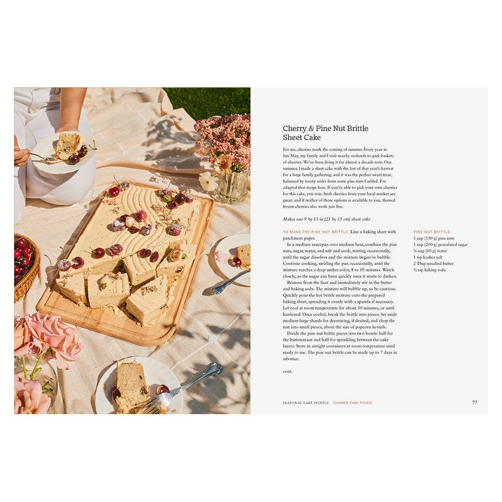 Sheet cake with cherry and pine nut brittle on a table with flowers and people eating, recipe text on the right.