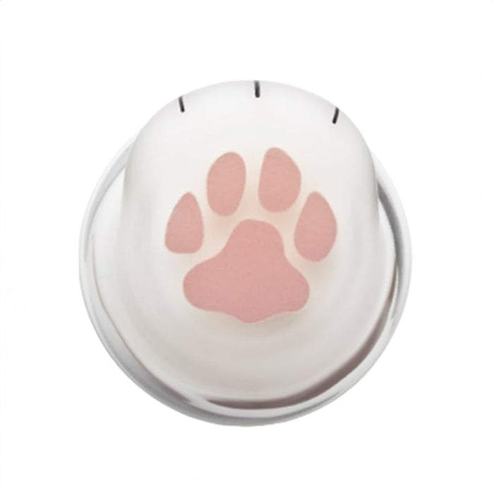 Bottom view of glass with paw print.