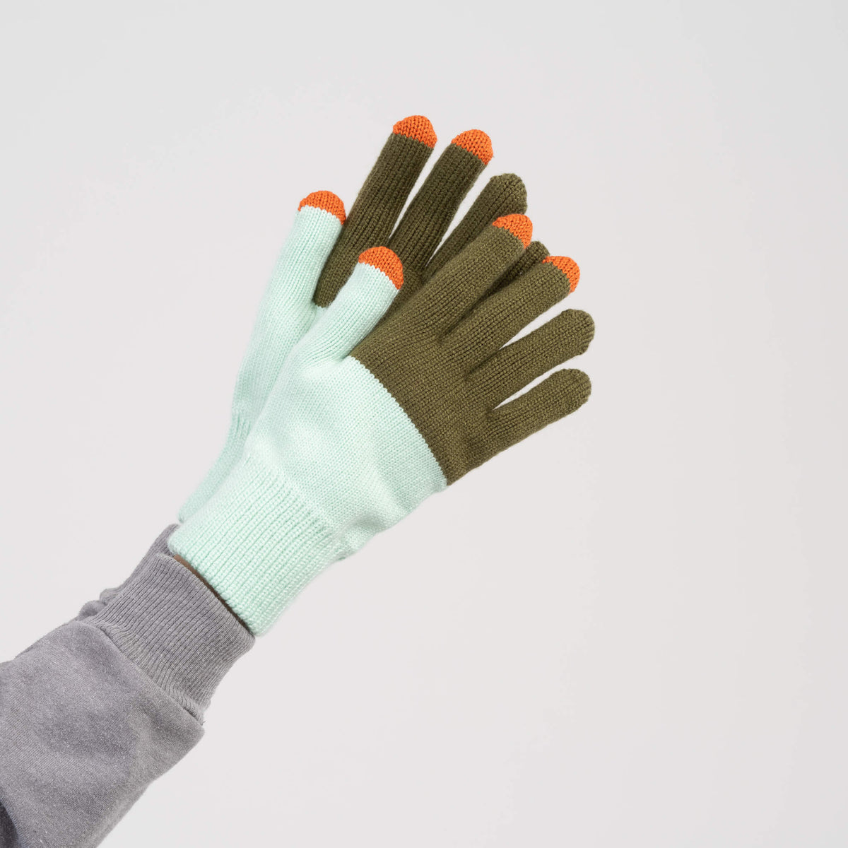 Pair of gloves with green and light blue design on a white background