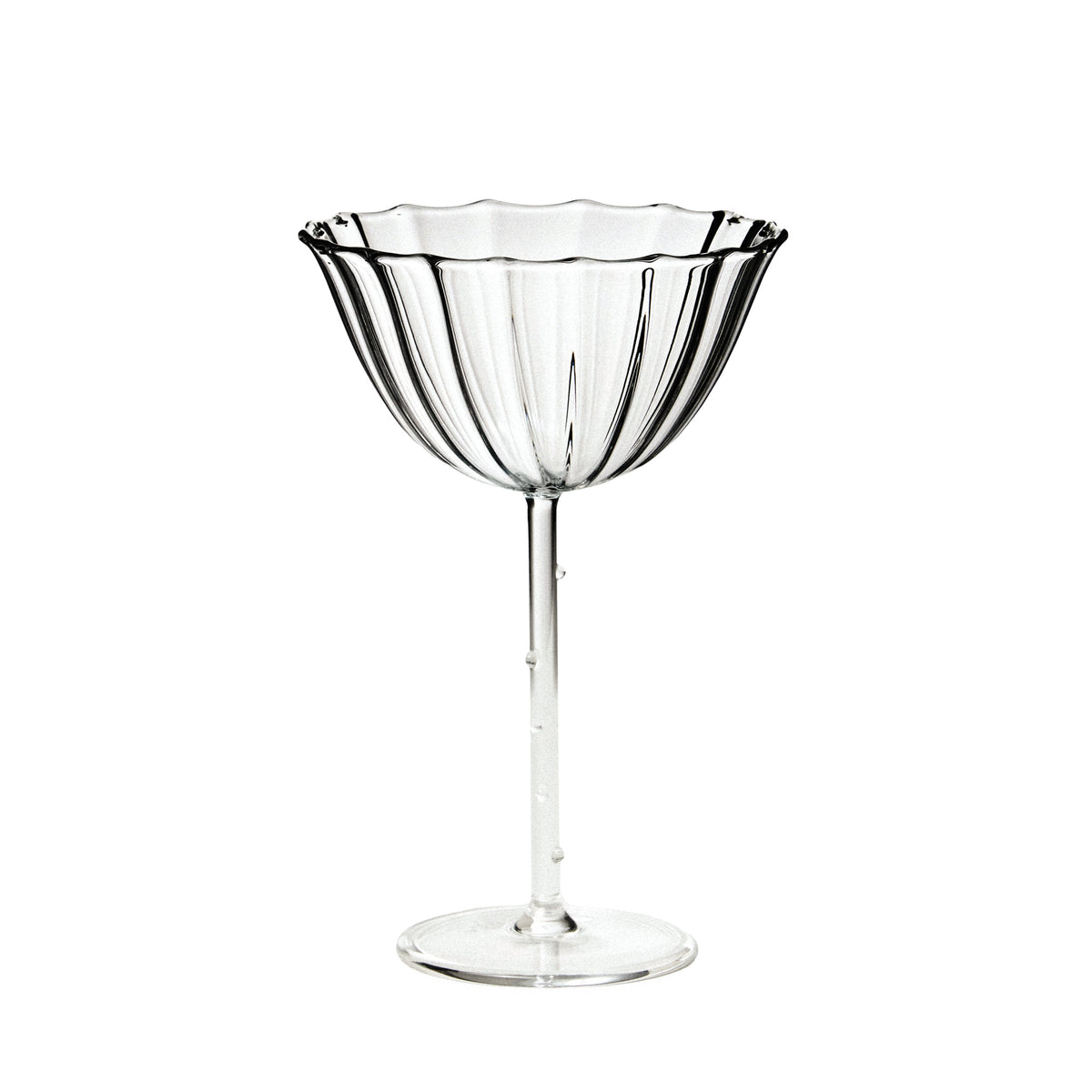 Clear glass cocktail glass on a white background
