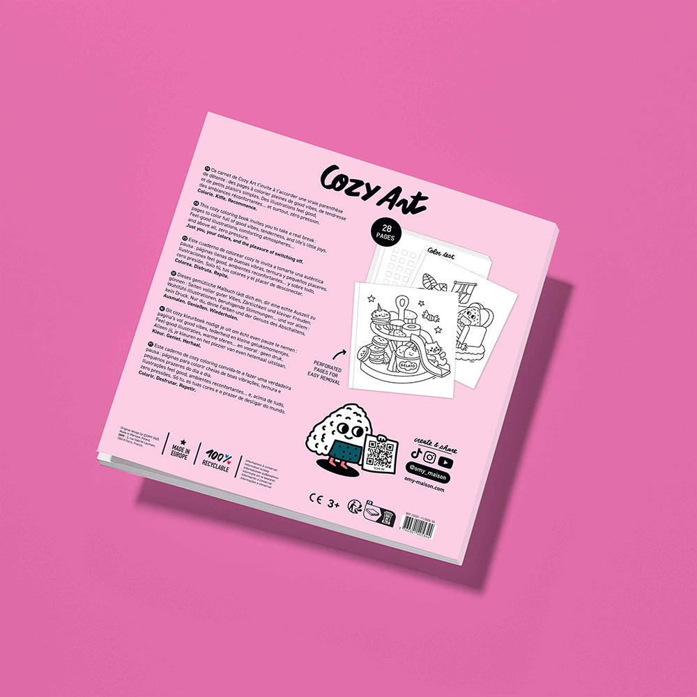 The back cover of a pink book or booklet titled 'Cozy Art' by Cozy Art, displayed at an angle on a solid pink background. The cover features black text, small illustrations.