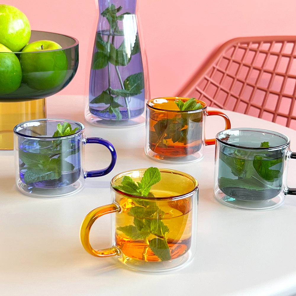 Cups with tea on table.
