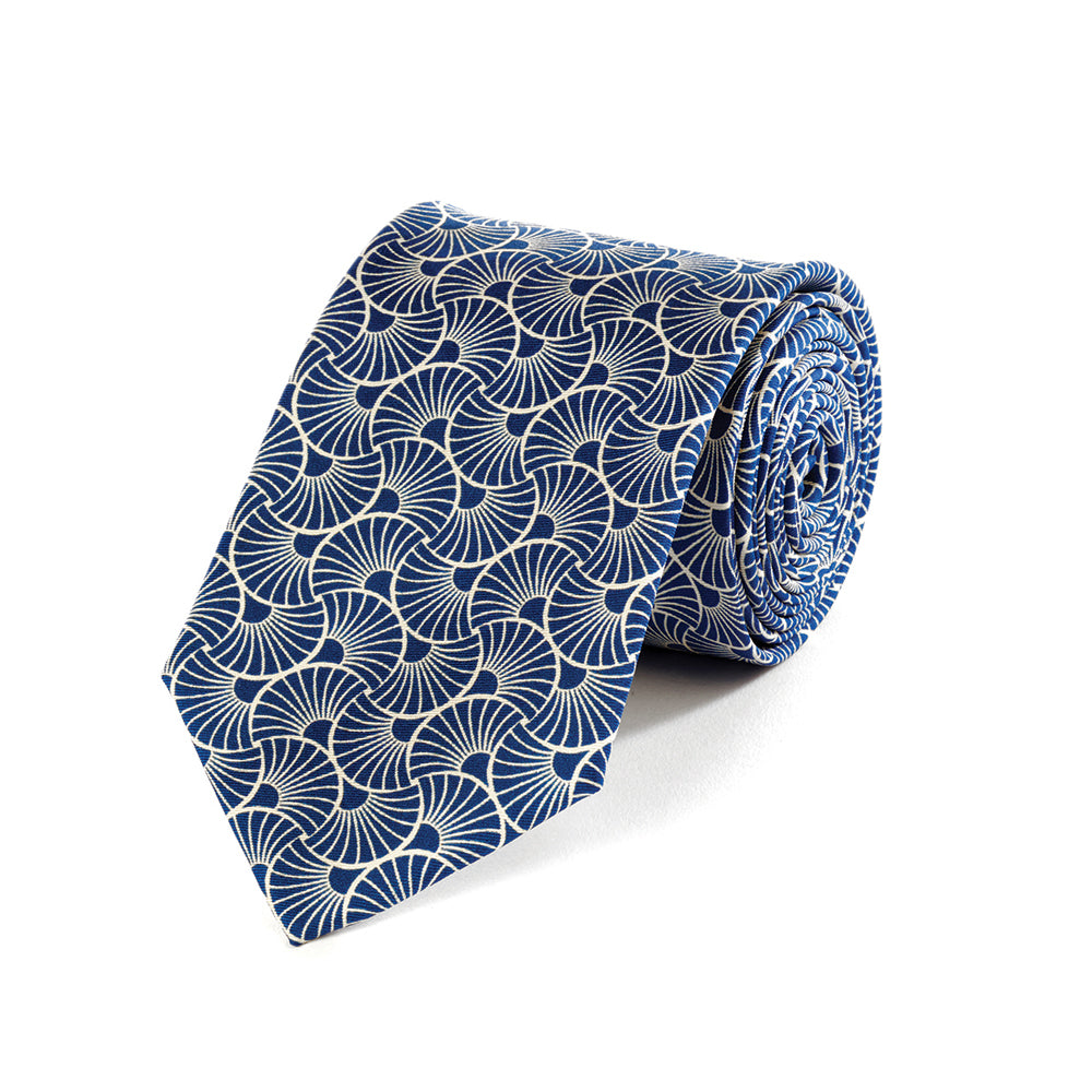 Blue patterned tie on a white background