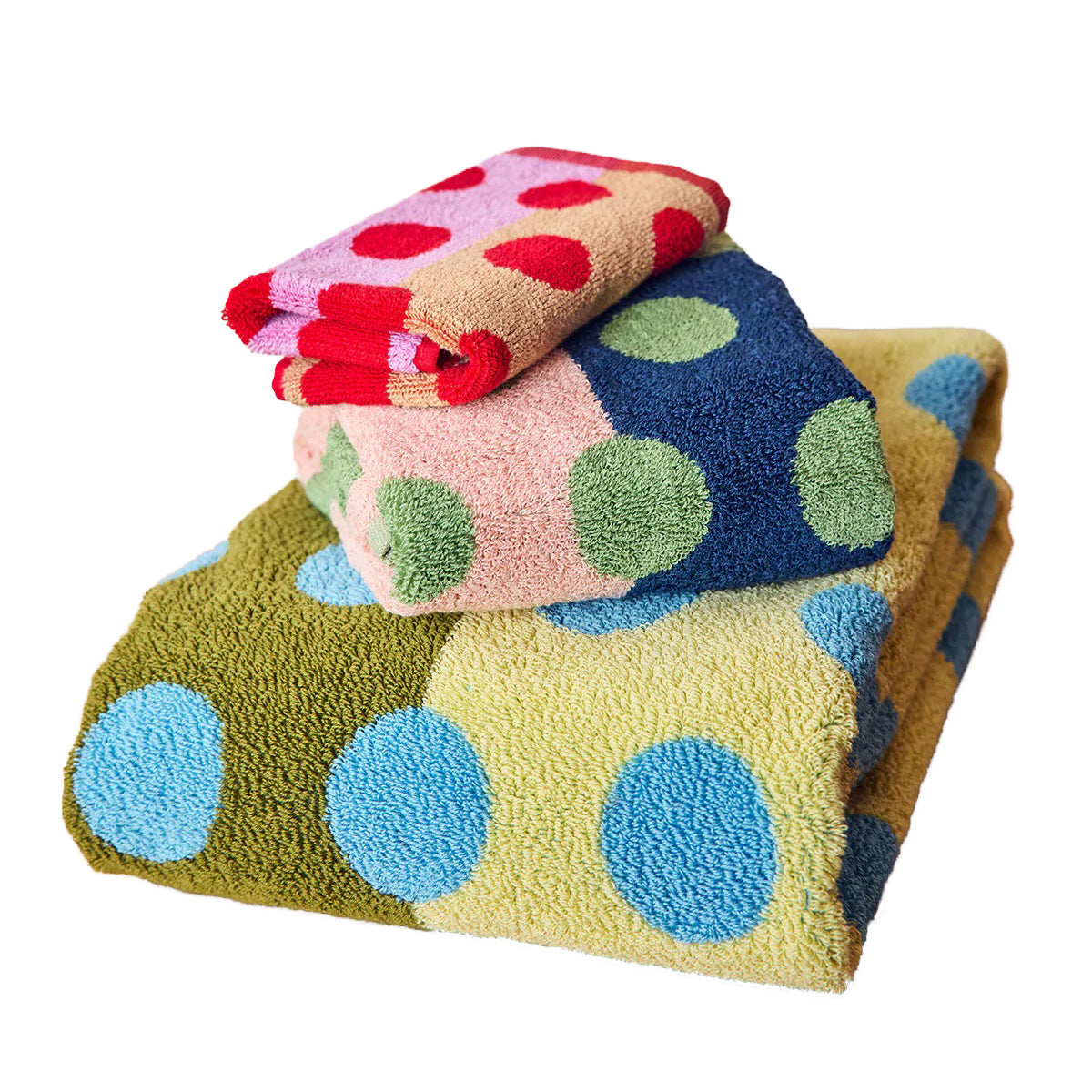 Stack of colorful polka dot towels on a white background